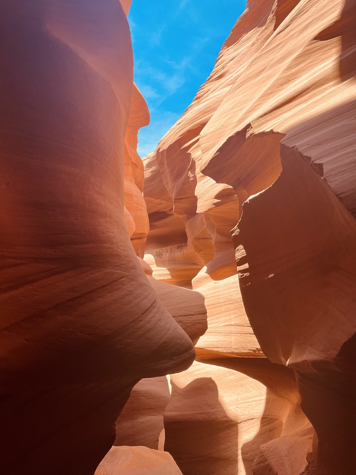Sandstone curves inside a narrow canyon.