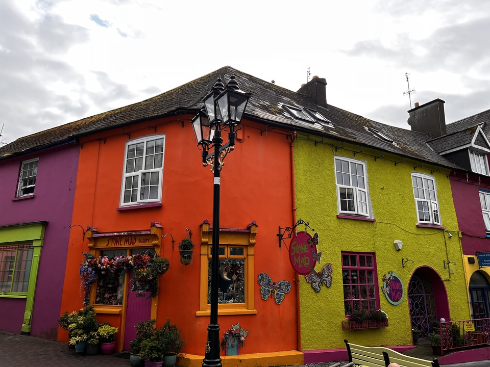 Vibrantly colored buildings with a street lamp in a quaint street.