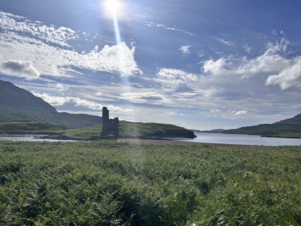 Ruins of a tower on an island by a lake