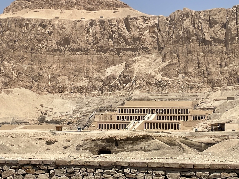 Temple of Hatshepsut set against rocky cliffs.