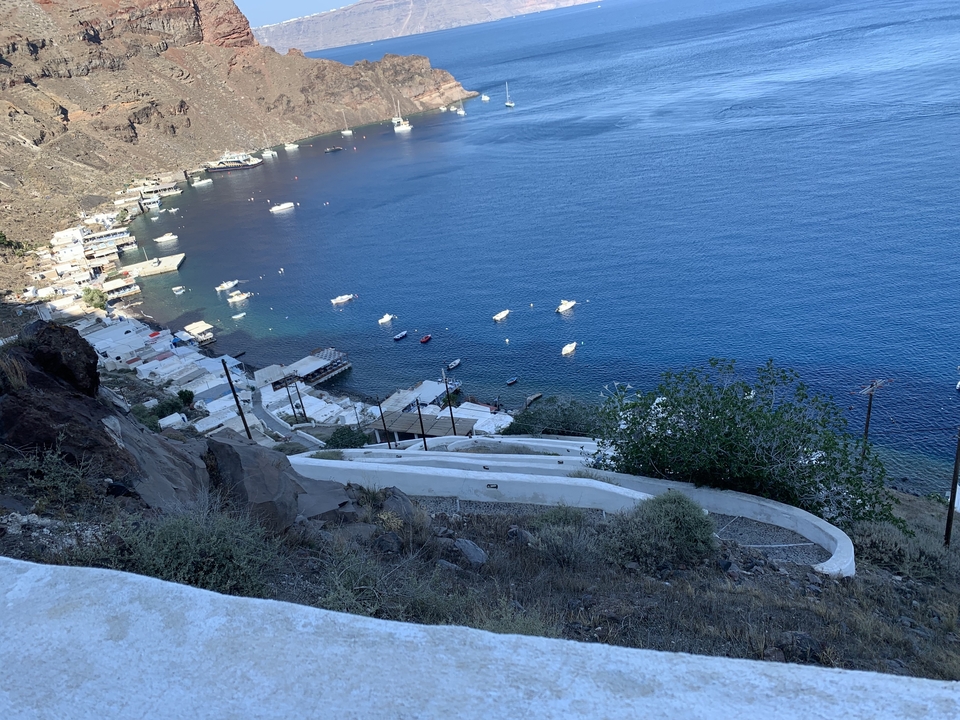 High viewpoint overlooking a coastline with docks.