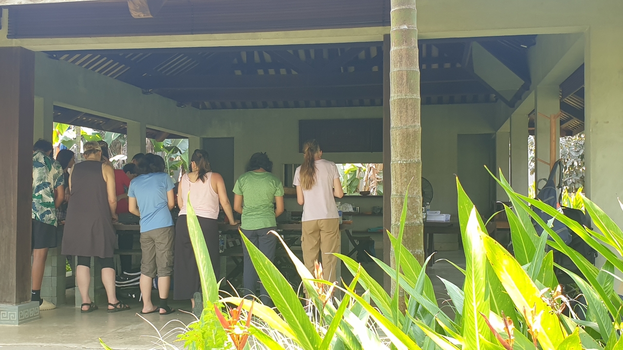 Group activity in a traditional open-air pavilion.