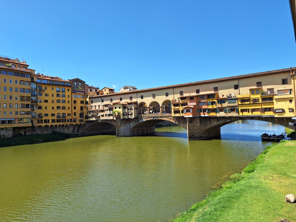 The Ponte Vecchio bridge over a river in Florence.