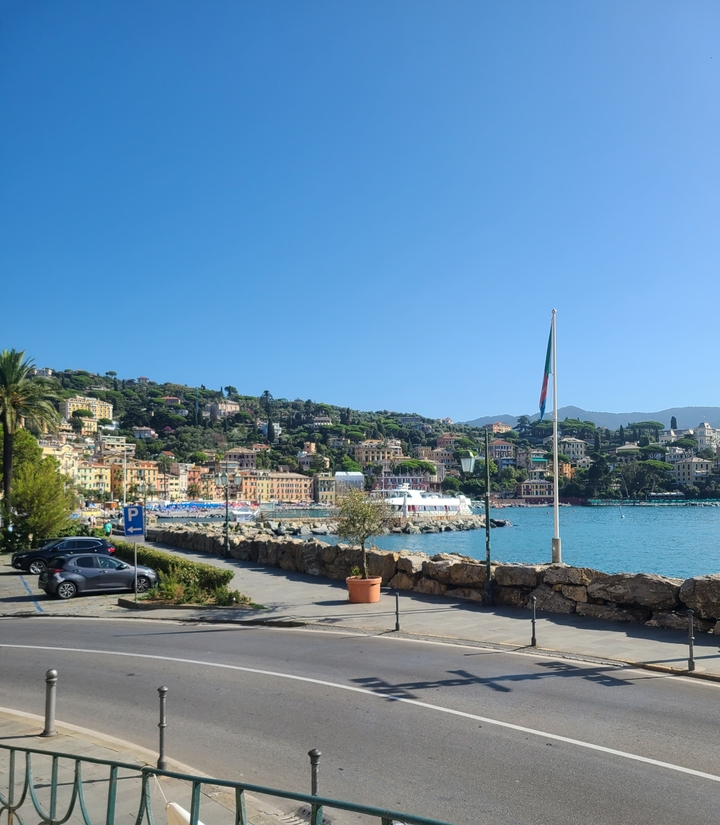 Coastal town with colorful buildings and boats docked in the water.