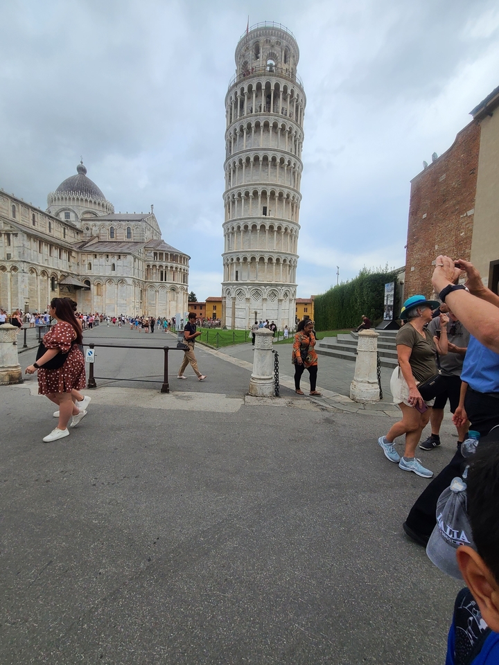 Leaning Tower of Pisa with tourists around.