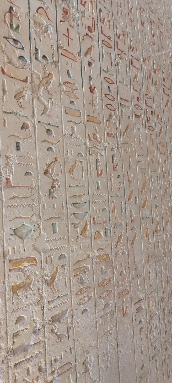 Wall with ancient Egyptian hieroglyphs.