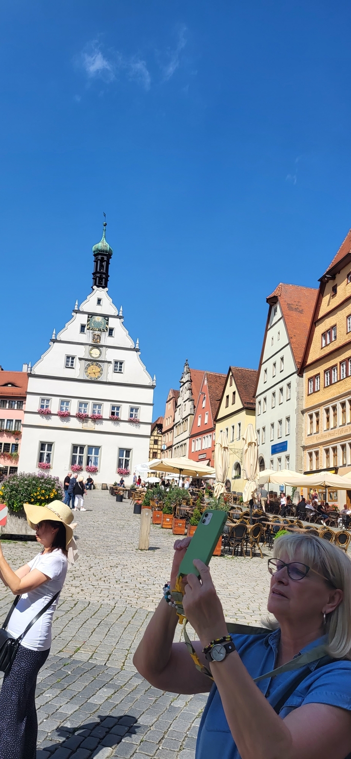 Colorful buildings with clock tower in a historic town.