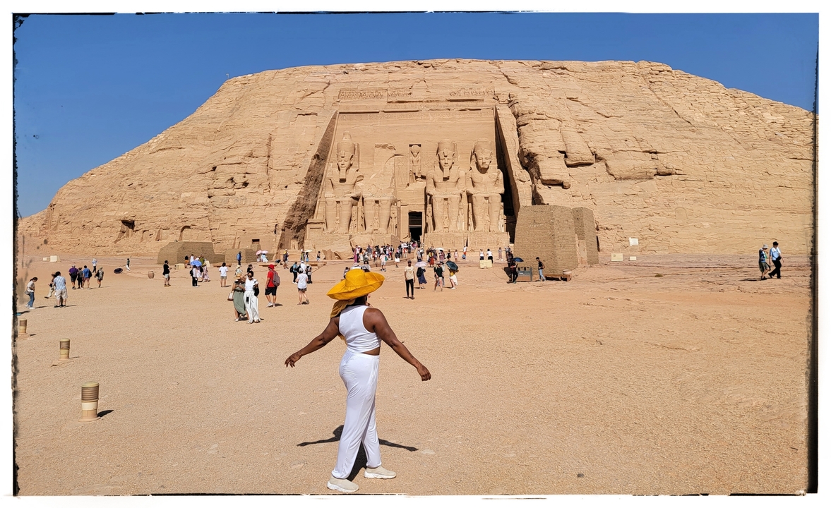 Person in front of the Abu Simbel temple, photo has a frame effect.