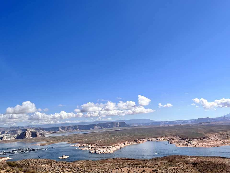 Expansive view of a lake with mountainous landscapes.