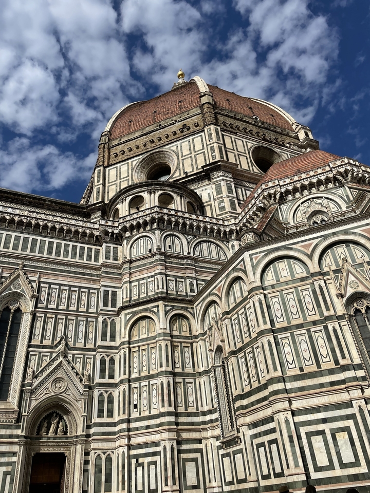 Facade of Florence's Cathedral with intricate designs.