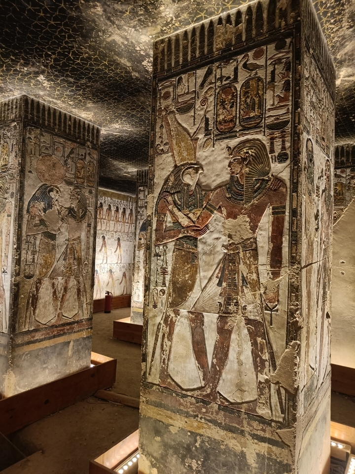 Interior view of a temple with detailed carvings and paintings.