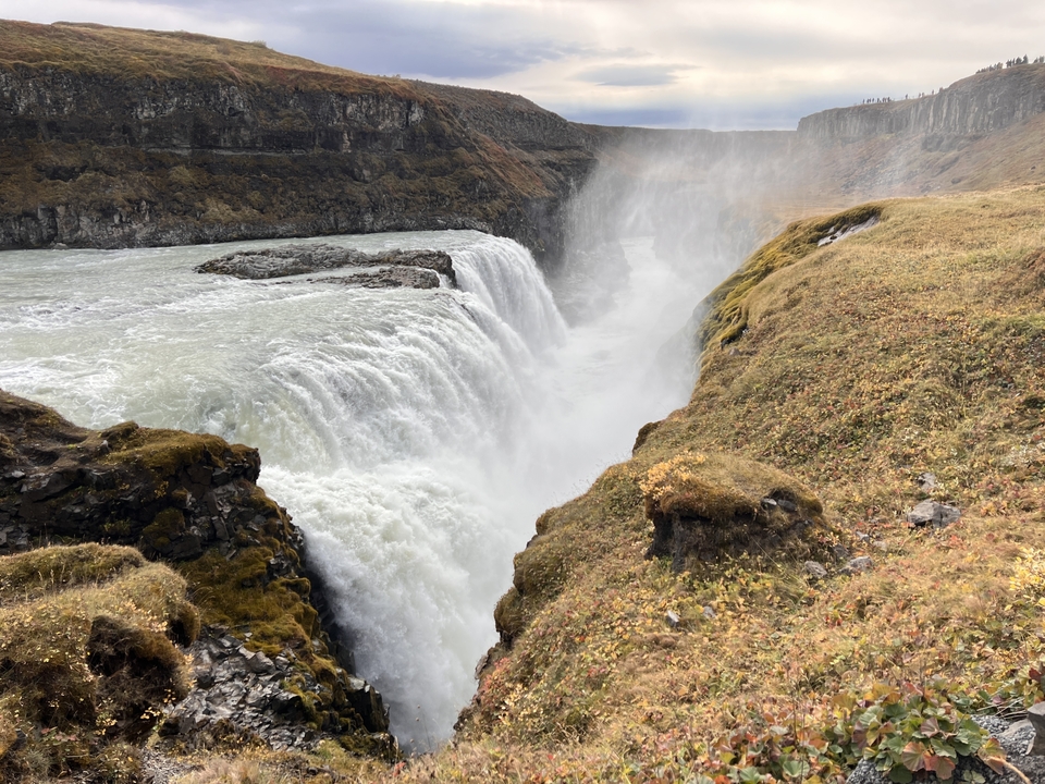 Powerful waterfall cascading into a canyon.