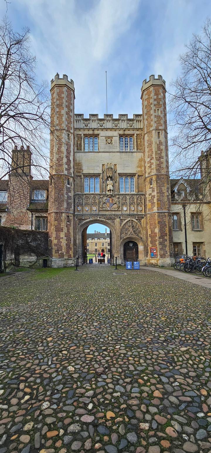 A historical stone gate with emblematic designs.