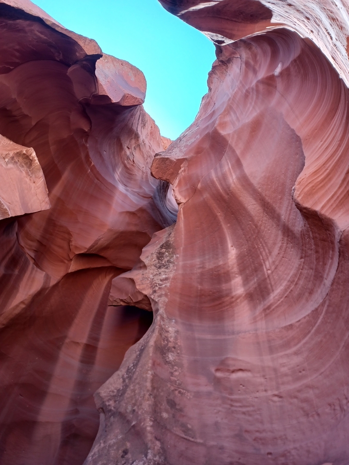 Curved red rock formations in Antelope Canyon.