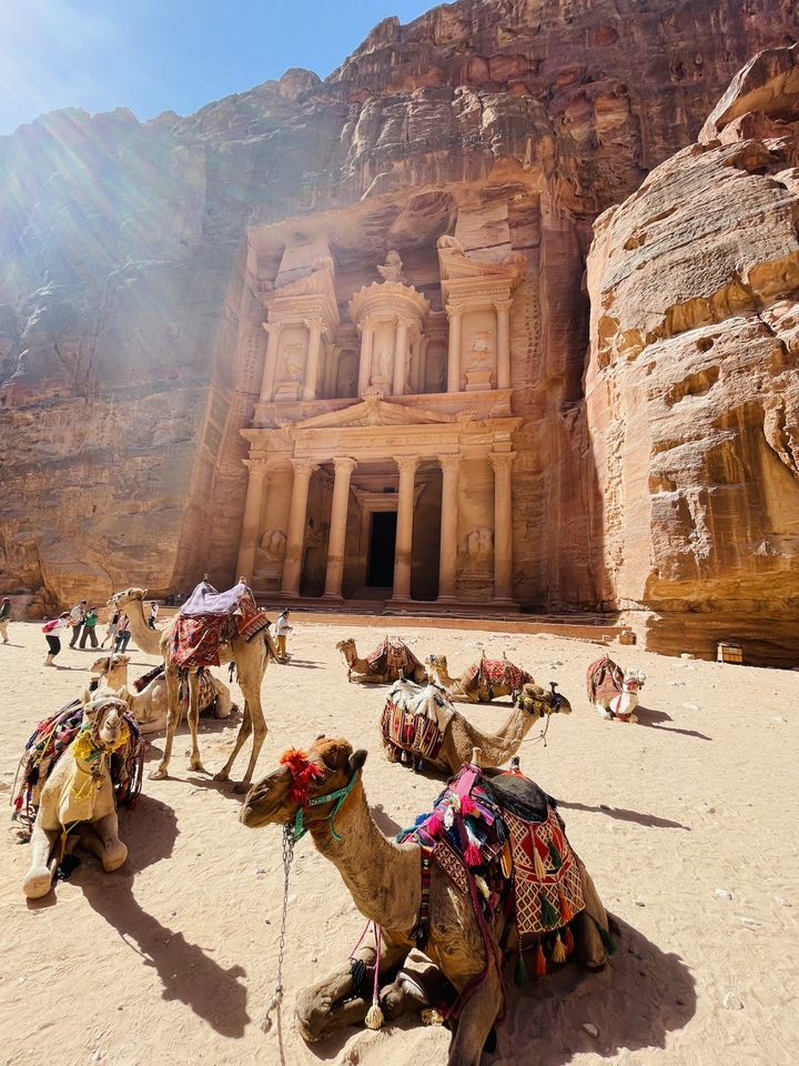 The Treasury at Petra with tourists and camels.