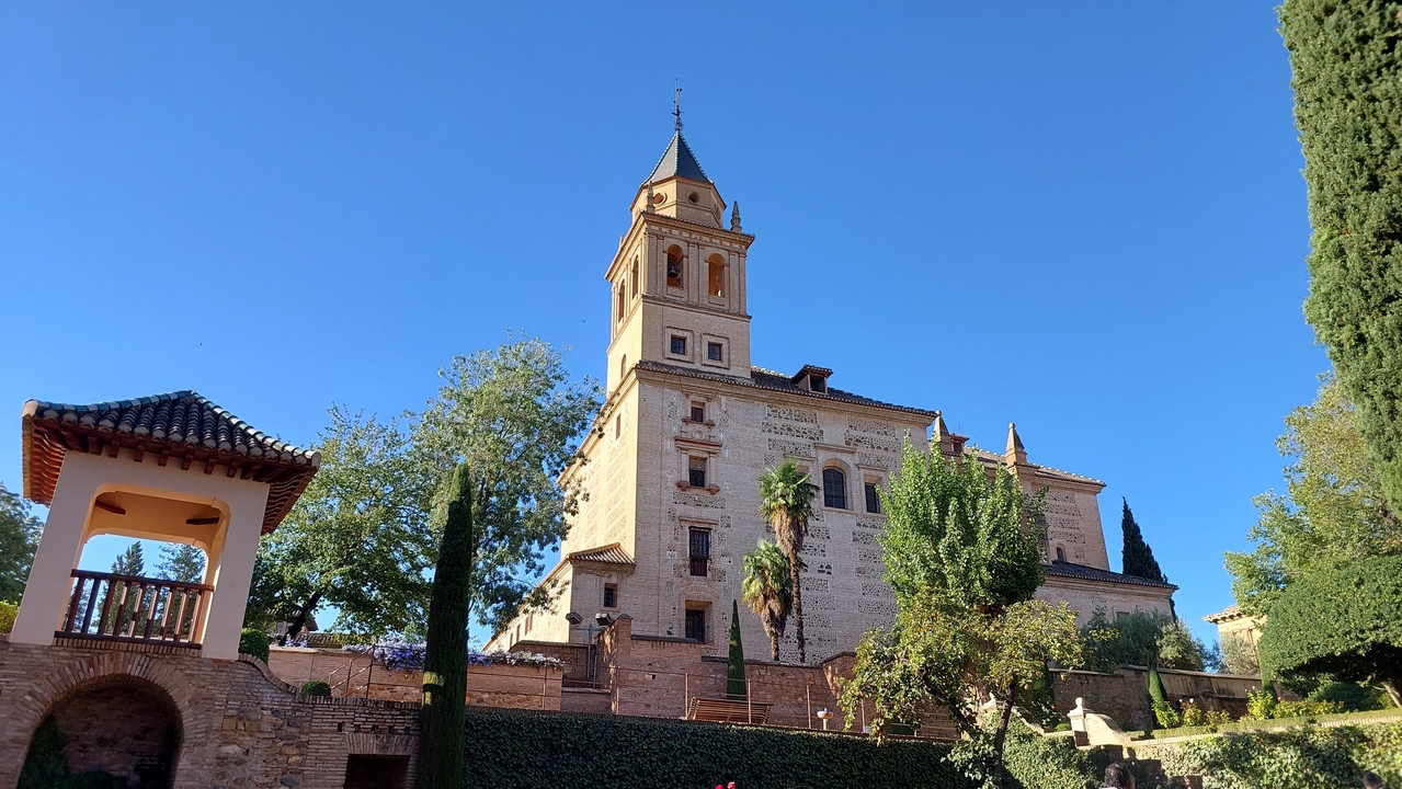 Historic tower surrounded by lush greenery.