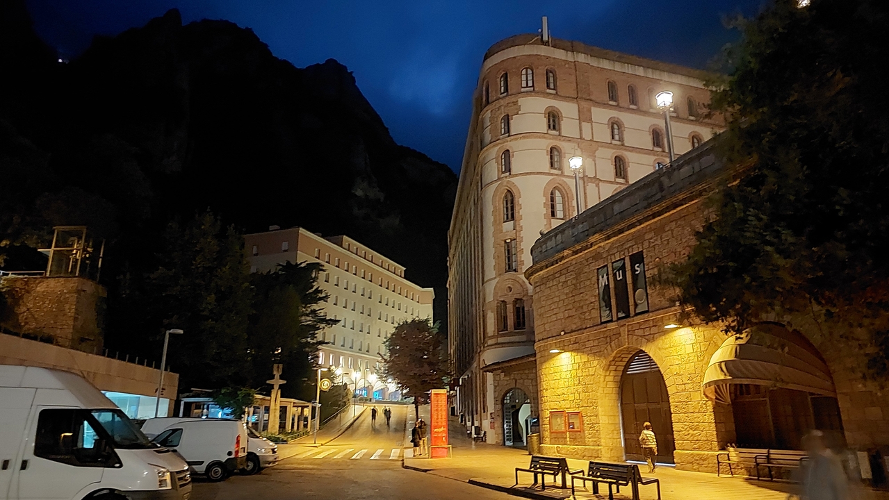 Historic buildings with minimal lighting at night.
