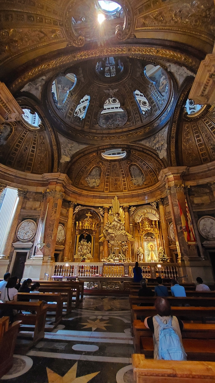 Ornate interior of a historical building with golden decorations.