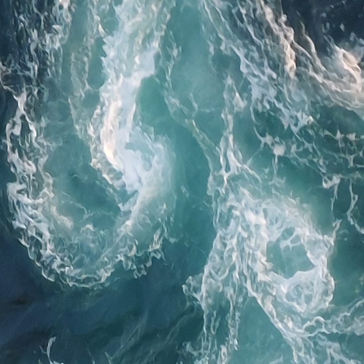 Close-up of swirling water, possibly a whirlpool.