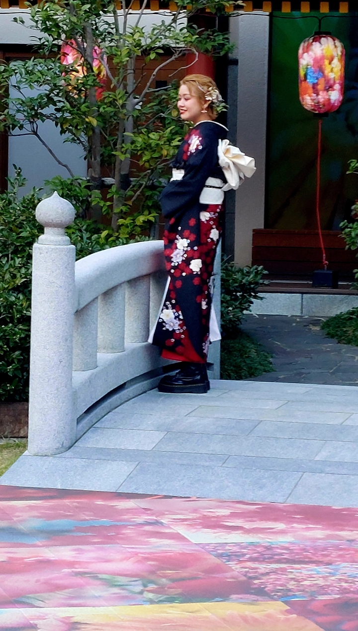 Traditional clothing with floral patterns on bridge.