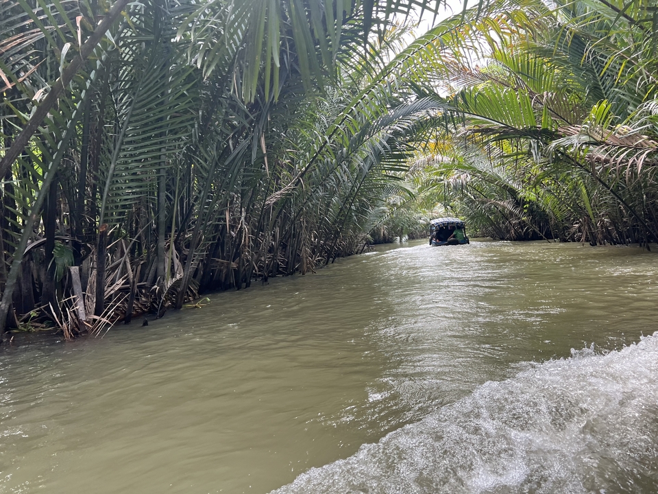 Boat ride through a lush, narrow waterway.