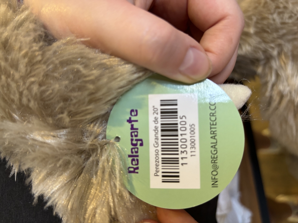 A close-up of a barcode tag on a plush toy.