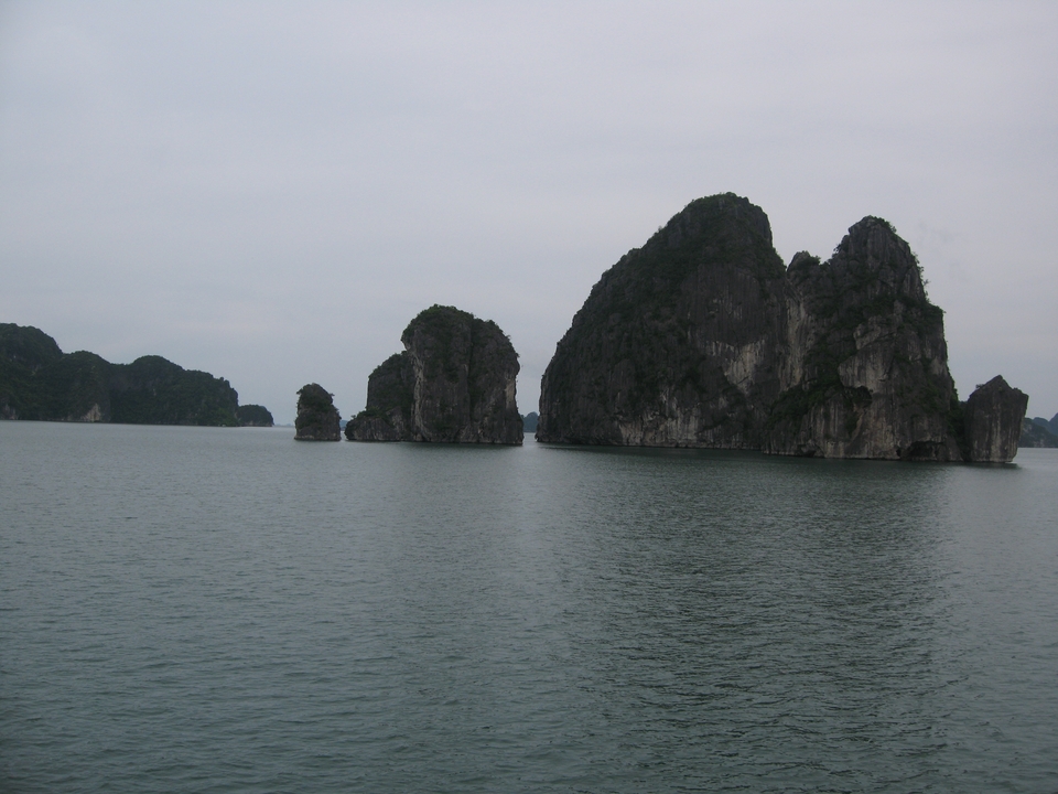 Limestone karsts by the sea in cloudy weather.