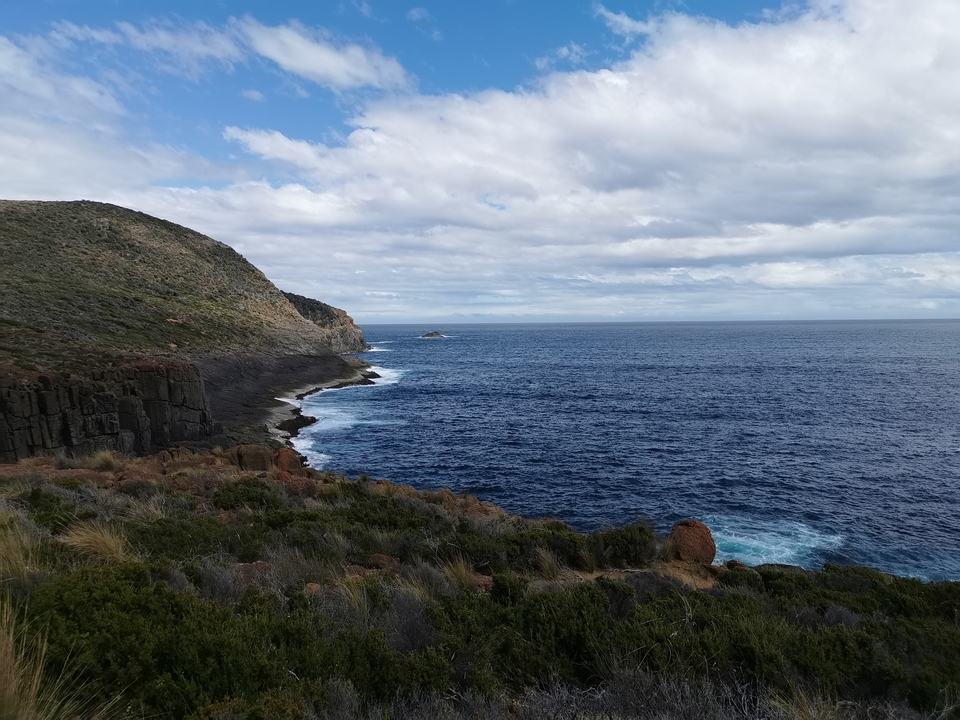 Coastal cliff with ocean horizon.