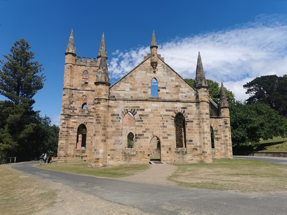 Ruins of a stone building with spires.