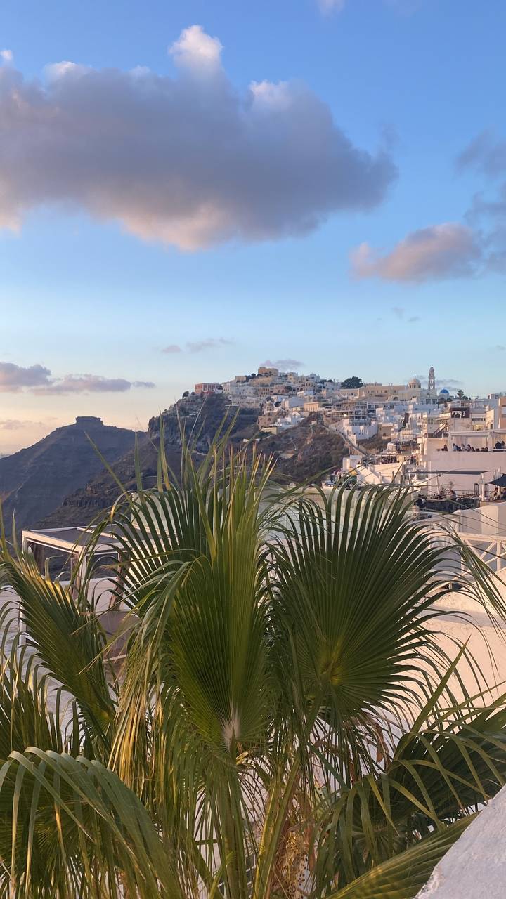 Clifftop buildings with a scenic view in the foreground.