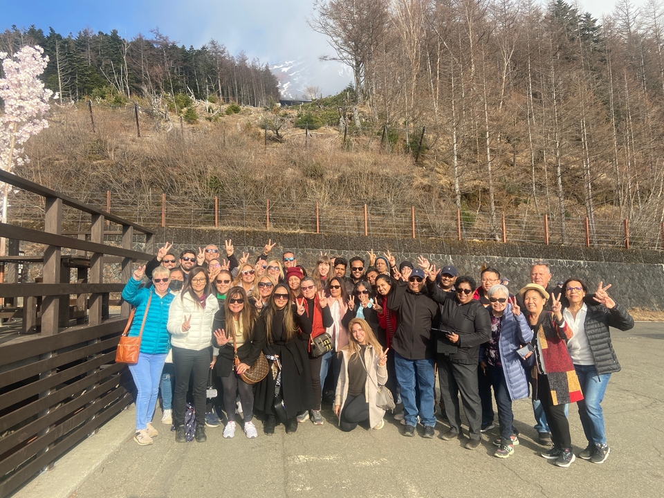 Large group of people posing for a photo, likely tourists.