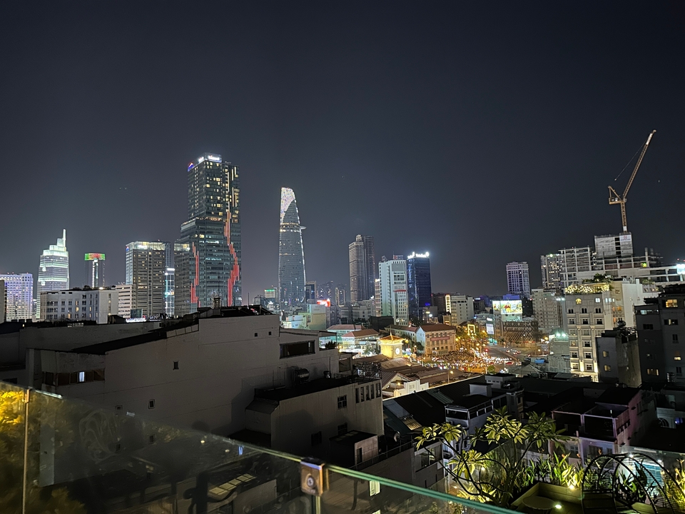 Nighttime cityscape with lit skyscrapers.