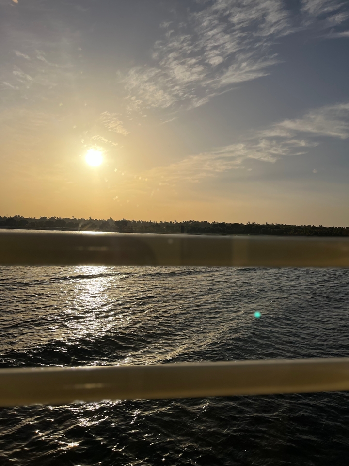 River landscape during sunset with reflections on water.
