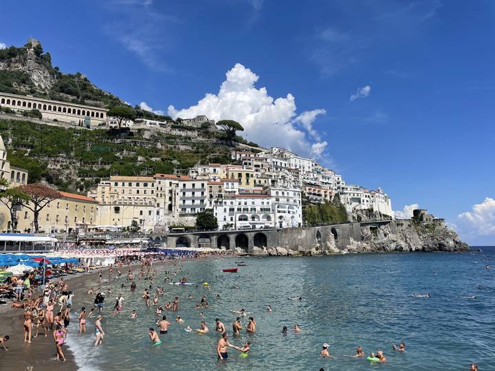 Upside-down view of crowded beach and coastal town