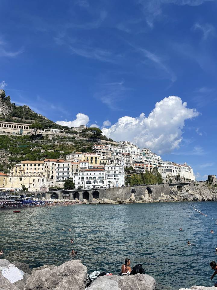 Coastal town with rocky sea and white buildings