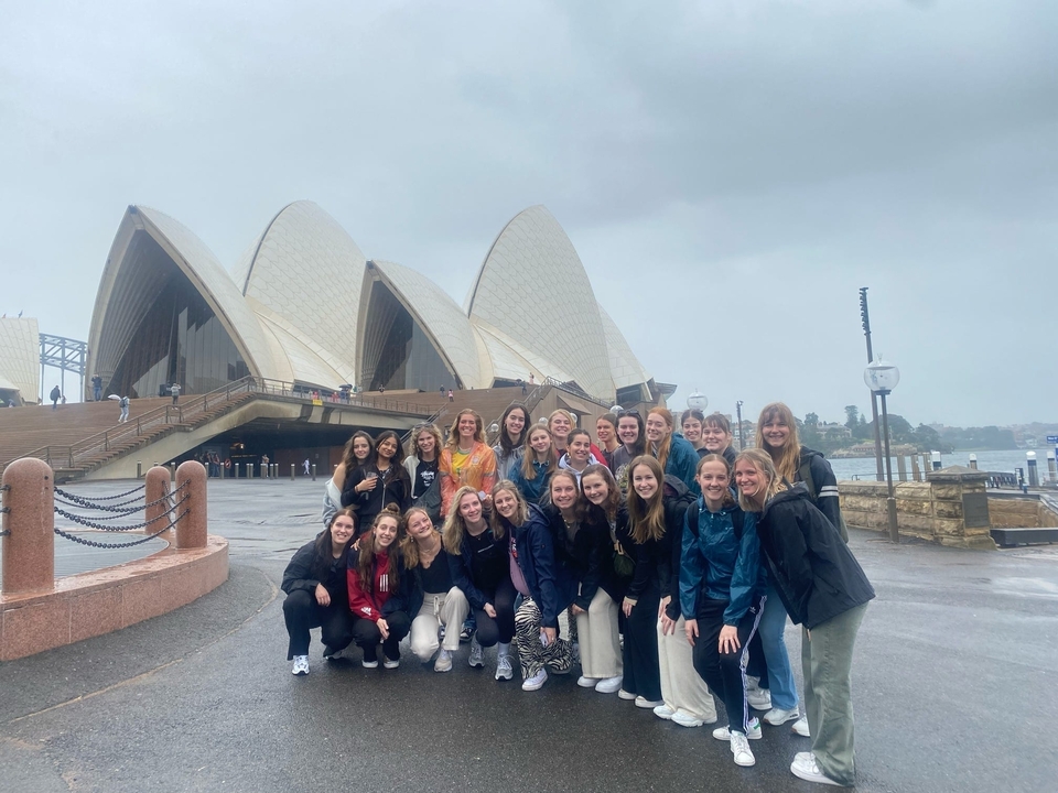 Group pose in front of the Sydney Opera House.