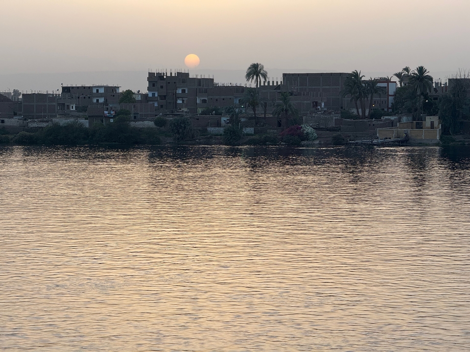 A scenic view of the Nile River at sunset.