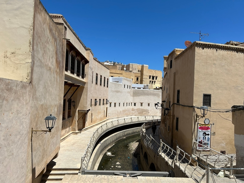 Old city street surrounded by buildings.