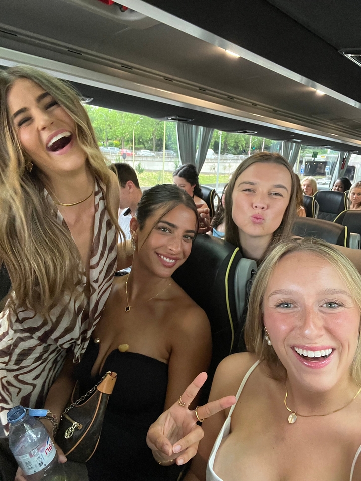 Group selfie on a bus with lively atmosphere