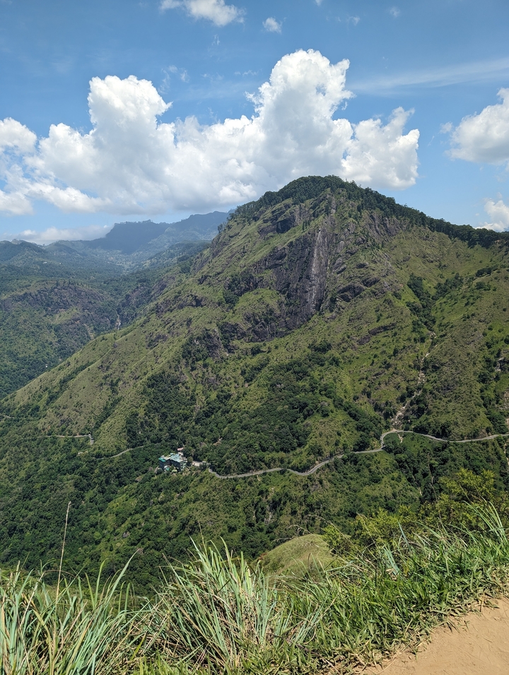 Mountain landscape view with winding road.