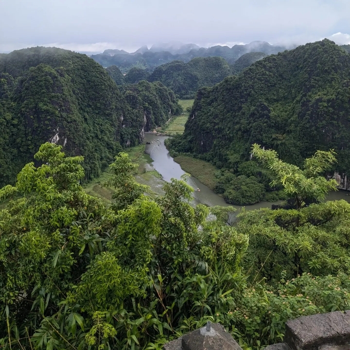 A scenic view of a river winding through lush green valleys.