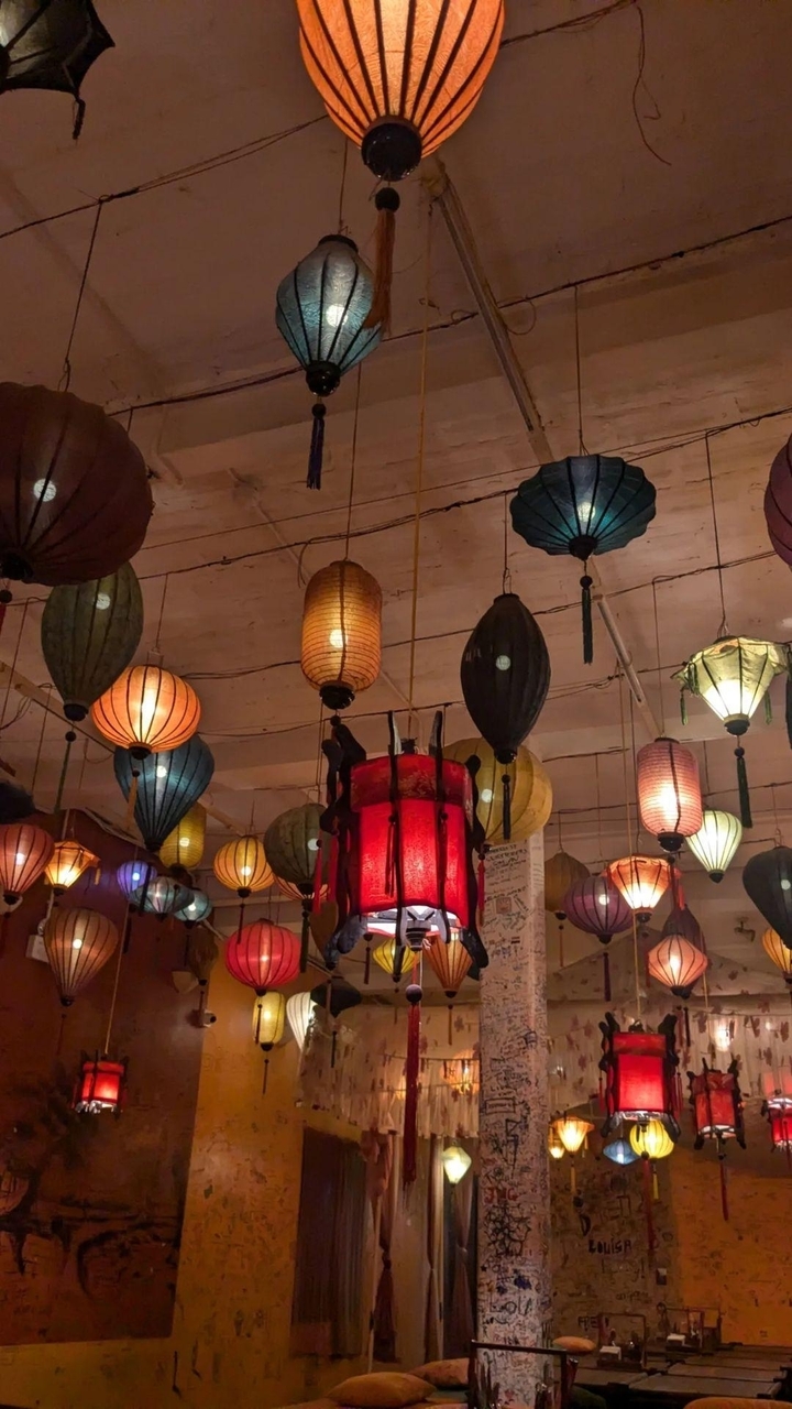 Colorful lanterns hanging from a ceiling.