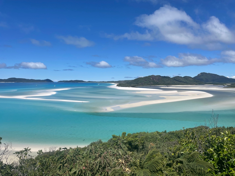 Stunning view of the Whitsunday Islands with turquoise waters and white sand.