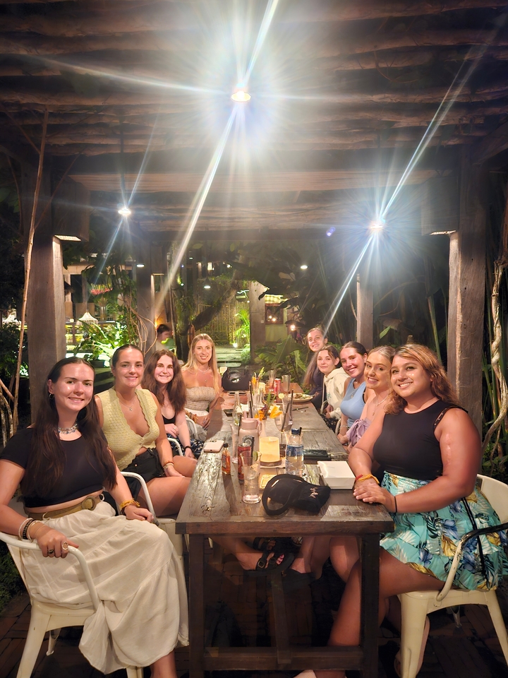 Group of people dining under atmospheric lighting