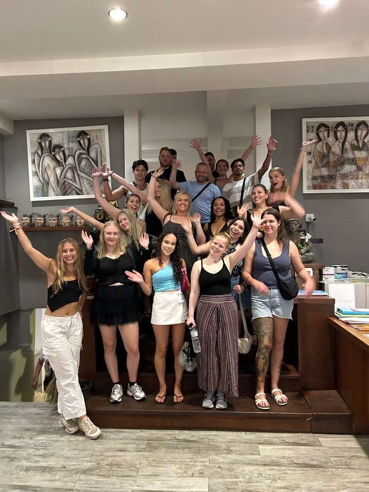 Large group of people posing together indoors.
