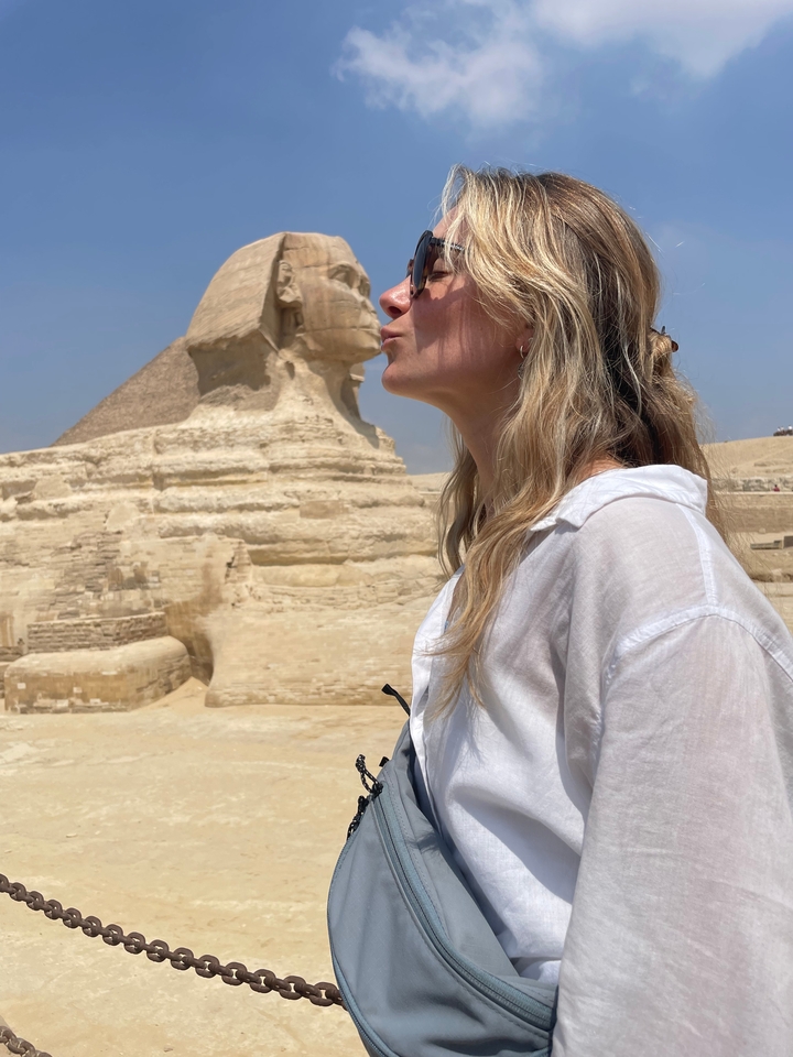 Person posing near the Sphinx.