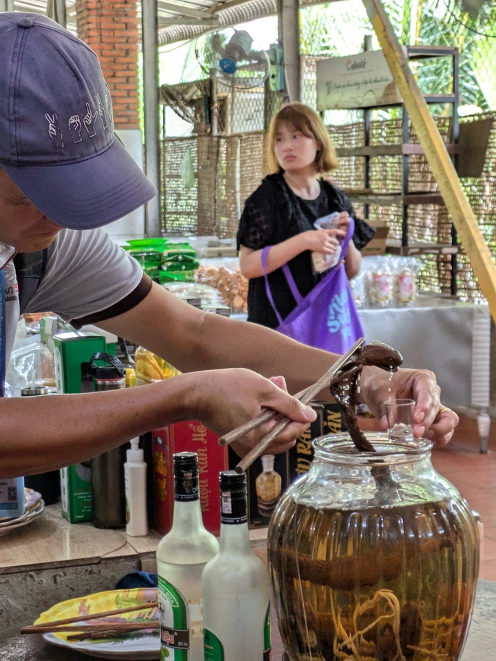 Person preparing food with various items on a counter.