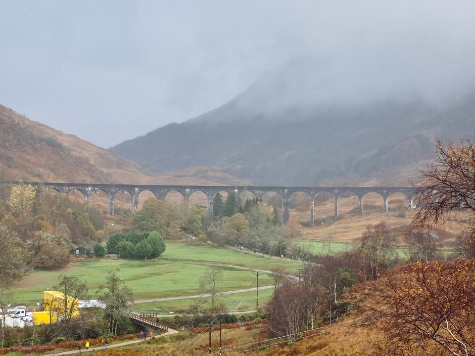 Scenic view of viaduct in a foggy valley.