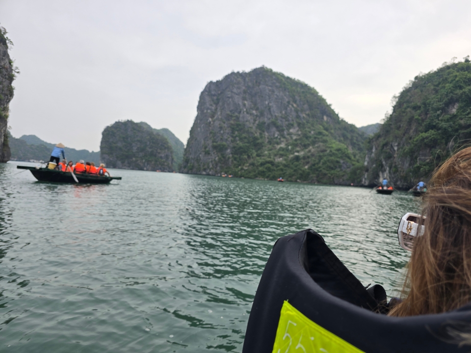 Scenic limestone landscape with boats on the water.