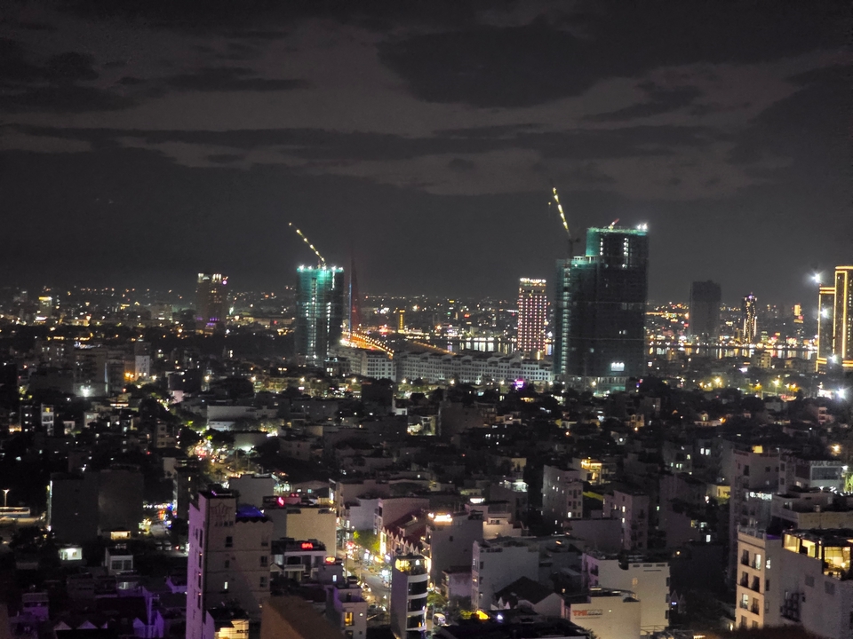 City skyline view at night showing high-rise buildings.